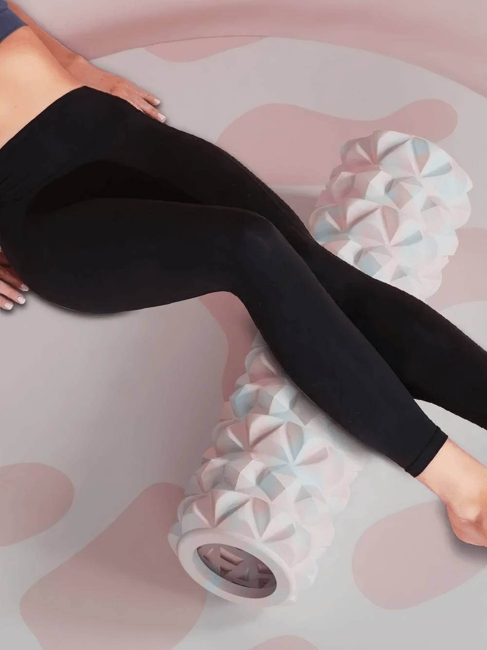 Woman using a textured foam roller for yoga and massage therapy on her legs, SF3294 fitness tool for muscle relief and flexibility.