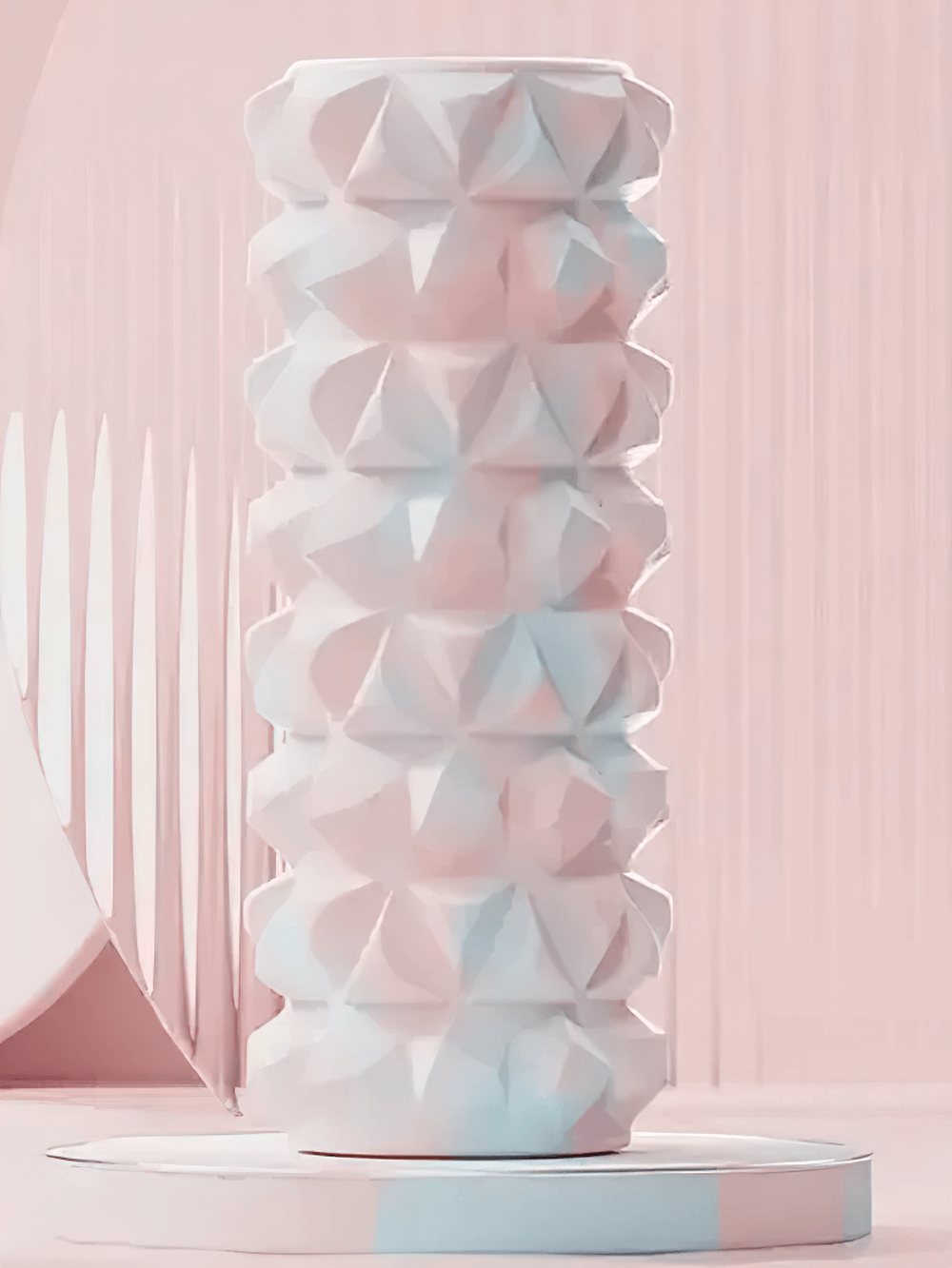 Textured pink foam roller for yoga and massage therapy, ideal for muscle massage, myofascial release, and fitness recovery.