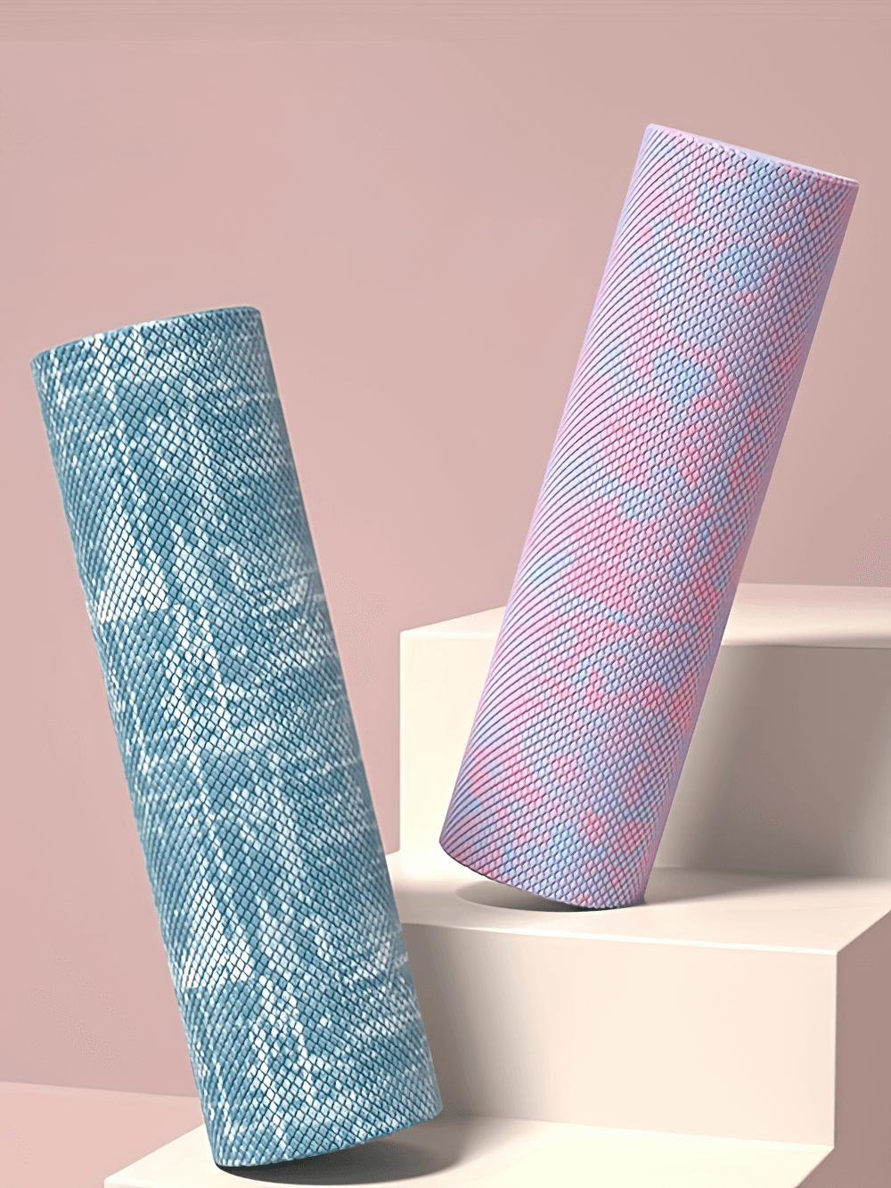 Textured EVA foam yoga rollers in mixed colors for deep muscle relief on display against a soft pink backdrop.