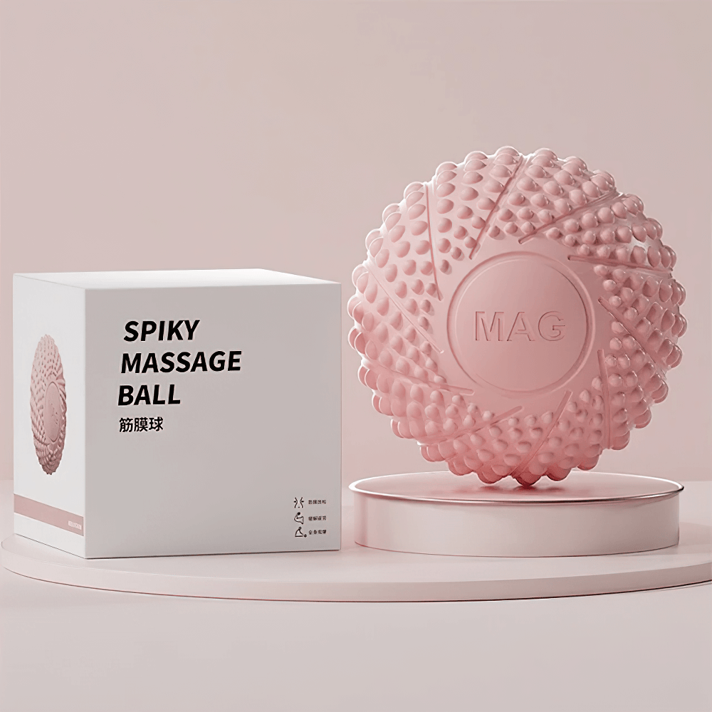 Textured pink massage ball with packaging for muscle relief and therapy.