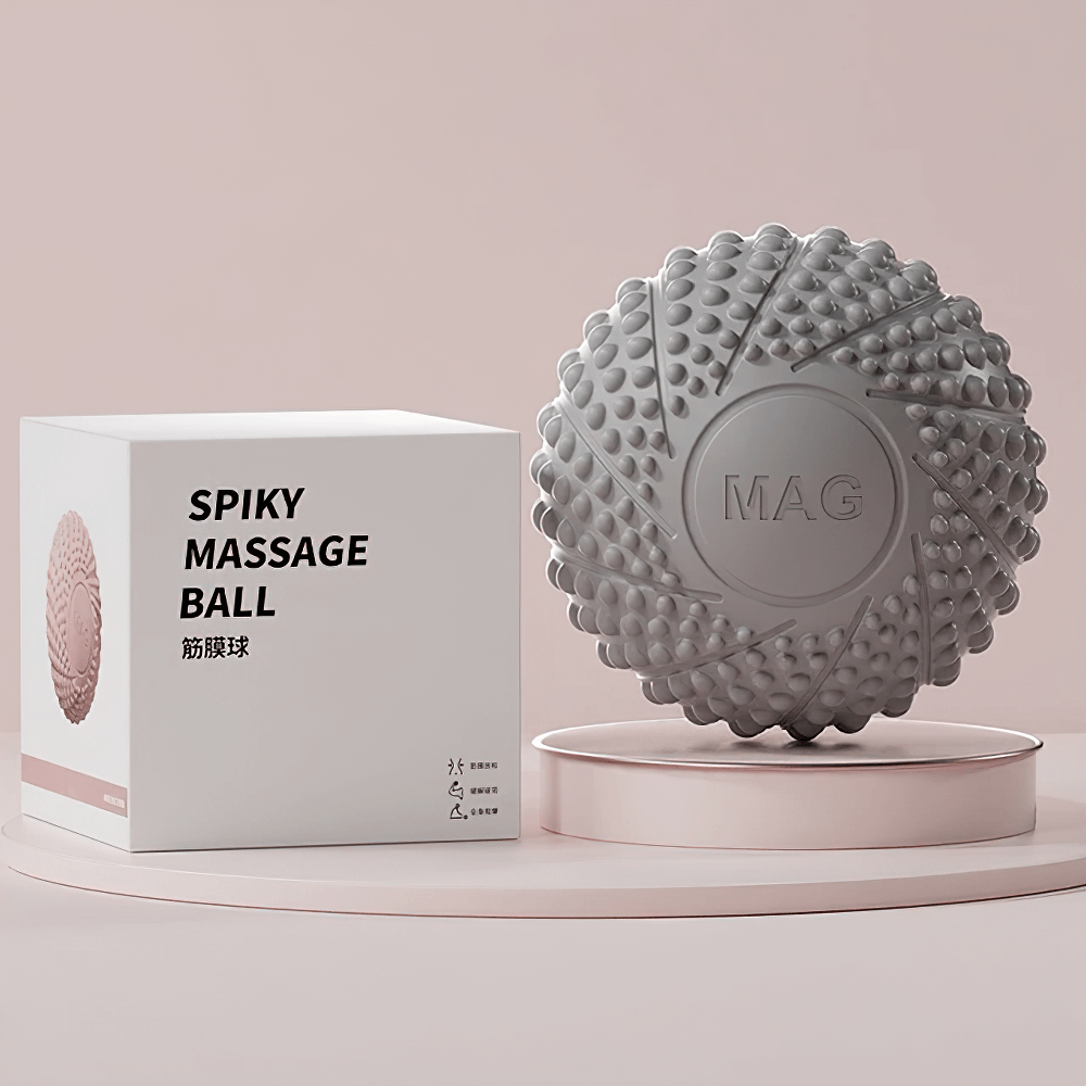 Gray textured lacrosse massage ball for muscle relief, perfect for trigger point therapy and myofascial release, with packaging.
