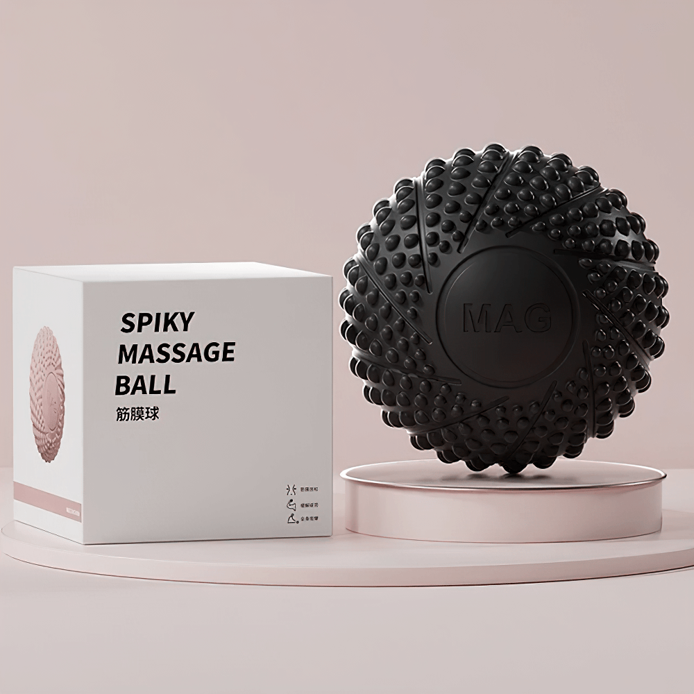 Black textured lacrosse massage ball with packaging for muscle relief and myofascial release therapy.