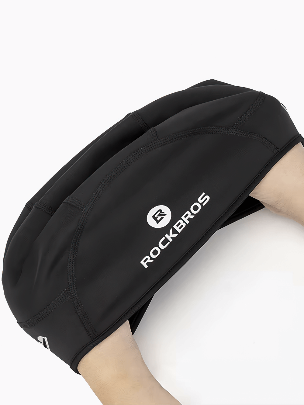 Black cycling beanie with Rockbros logo, featuring windproof material and thermal fleece lining for winter rides.