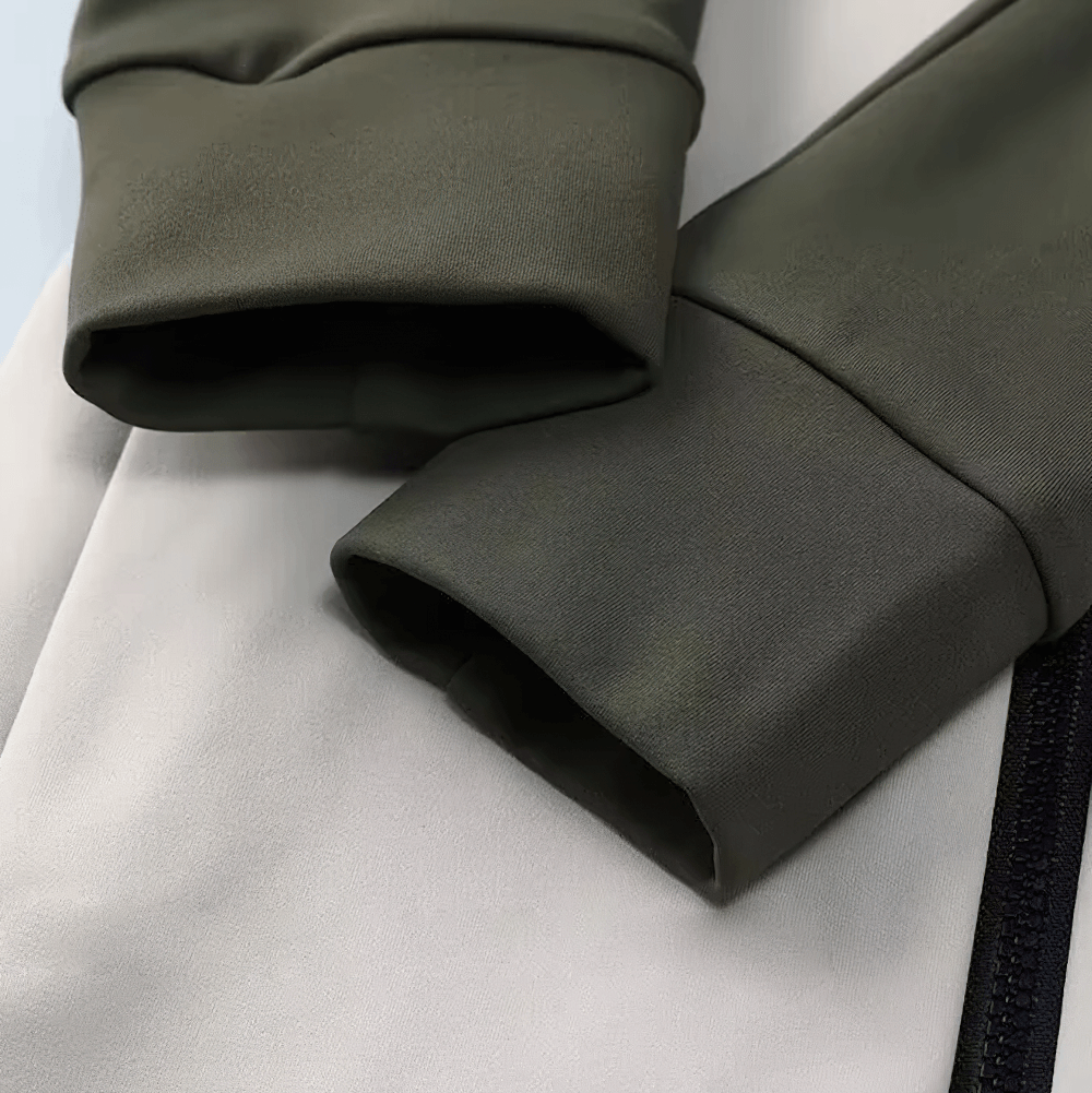 Close-up of sleeve and zipper details on the Thermal Cycling Jacket for Women, featuring durable polyester and spandex fabric.