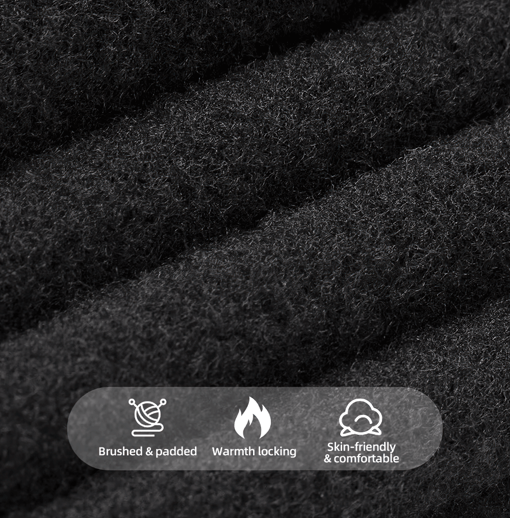 Close-up of black thermal fleece fabric, highlighting brushed and padded texture for warmth, luxury, and comfort in winter wear.