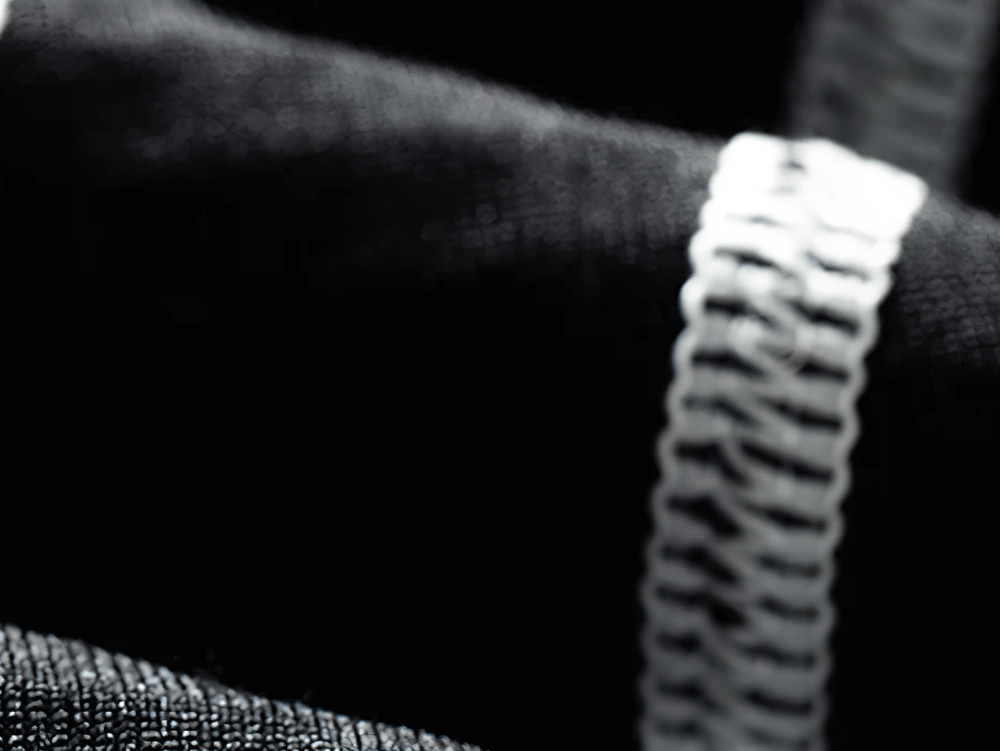 Close-up of thermal hooded top fabric with detailed stitching.