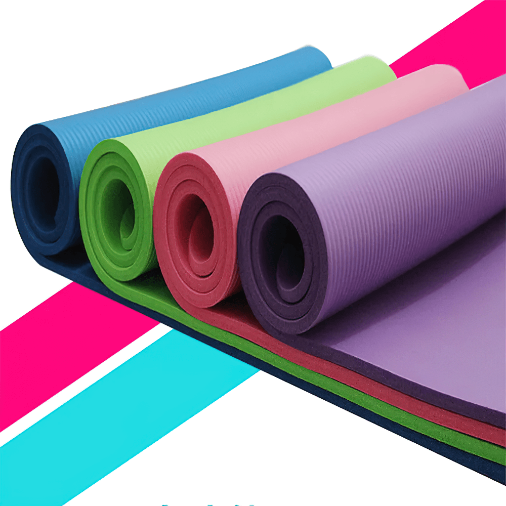 Colorful thick non-slip yoga and Pilates mats rolled up, showcasing vibrant hues and durable texture for fitness routines.