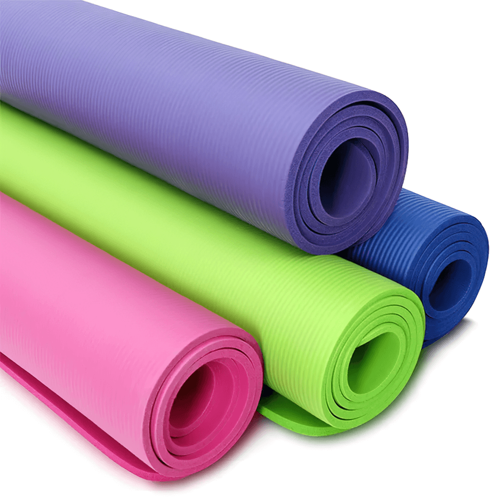 Colorful thick non-slip yoga mats rolled up, ideal for Pilates and floor exercises, featuring superior traction and cushioning.