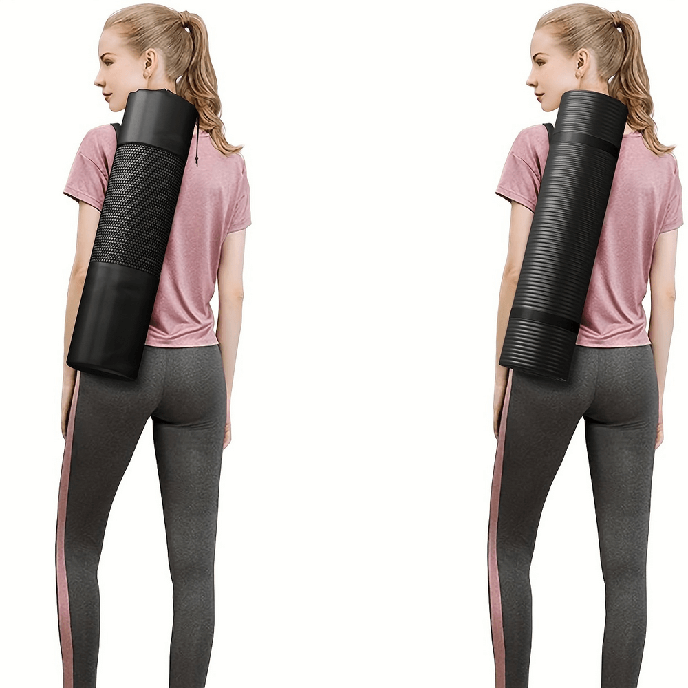 Woman carrying black thick non-slip yoga mat for home and gym workouts, showcasing its grip and durability.