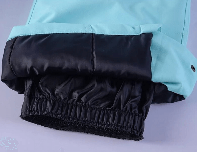 Close-up of Thickened Thermal Skiing Women's Suit SF1762 showing elastic cuff design in black and blue for warmth and wind protection.