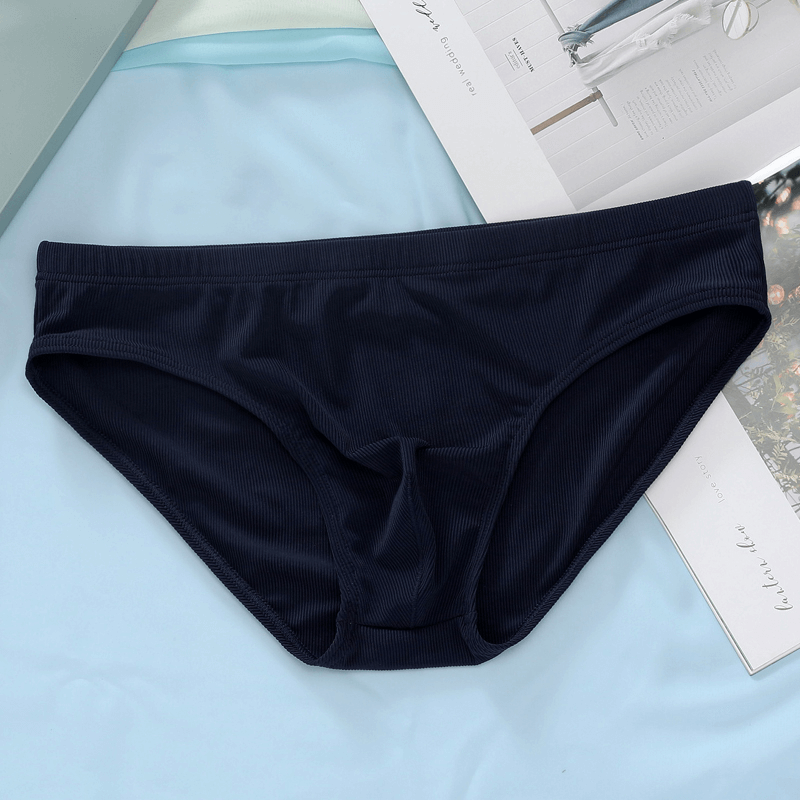 Navy blue thin breathable ribbed briefs for men, low-rise casual underwear, displayed on a light background.