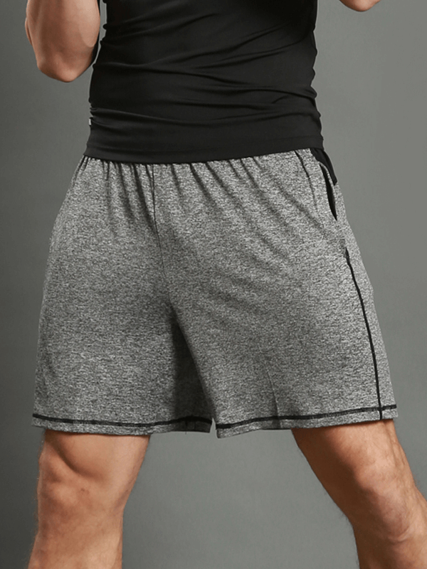 Man wearing gray thin breathable quick-dry workout shorts SF1480 for running, showing sporty and comfortable fit.
