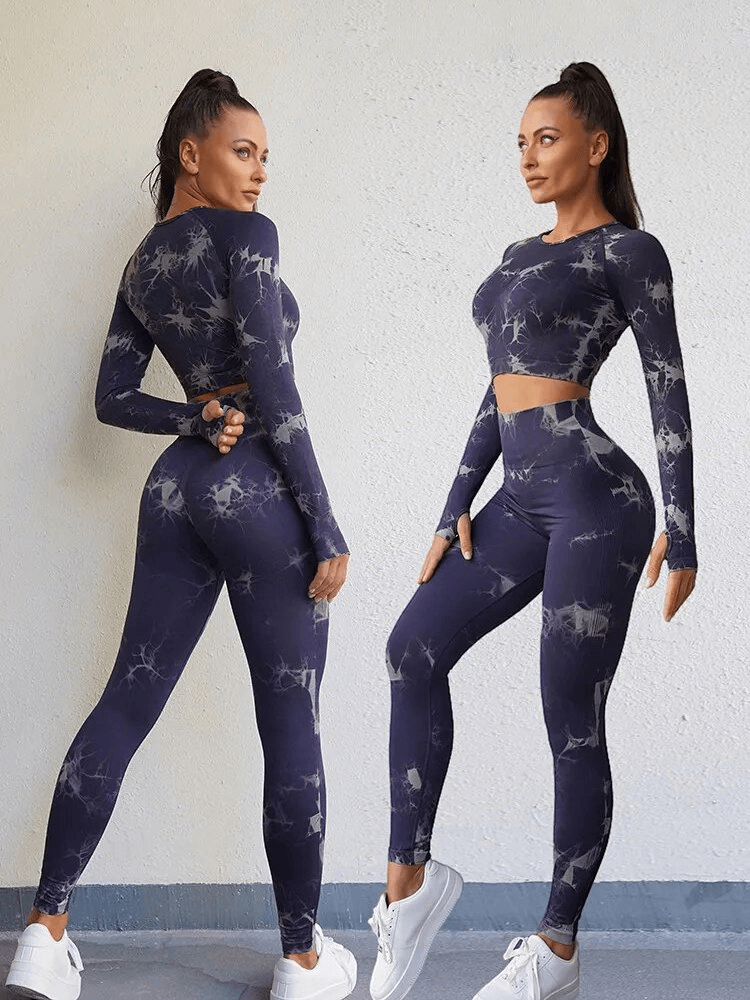 Woman wearing tight breathable two-piece yoga set, full-length sleeves and pants, stylish print design, ideal for comfortable workouts.