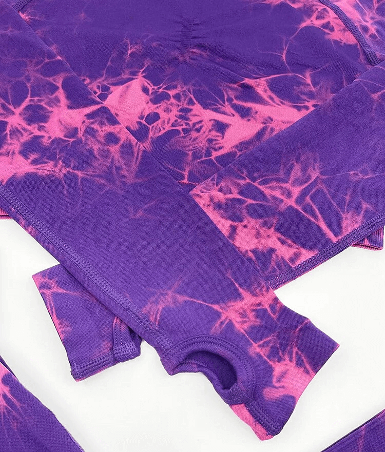 Purple and pink tie-dye sports two-piece yoga set with full-length sleeves, designed for women seeking style and comfort.