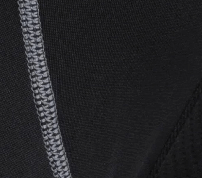 Close-up of black running leggings with grey stitching detail, highlighting breathable, moisture-wicking fabric for optimal performance.