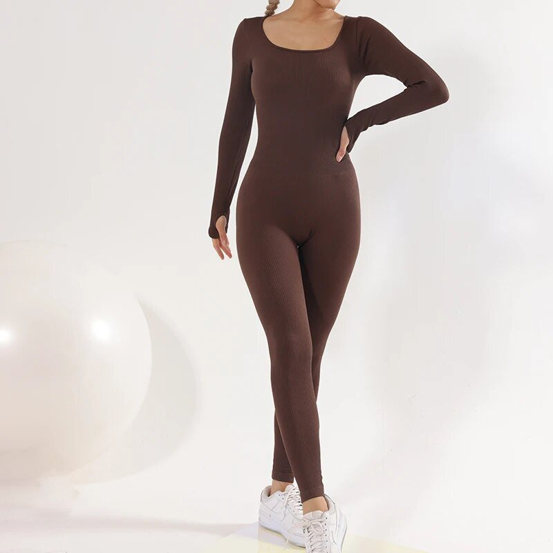 Woman in a tight brown one-piece sports jumpsuit, ideal for yoga, with full sleeves and anti-pilling, quick dry material.
