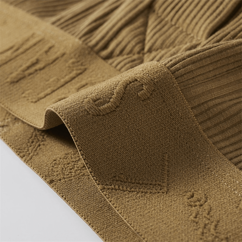 Close-up of brown fabric texture, showing detailed patterns and ribbed design, ideal for thermal wear comfort and warmth.