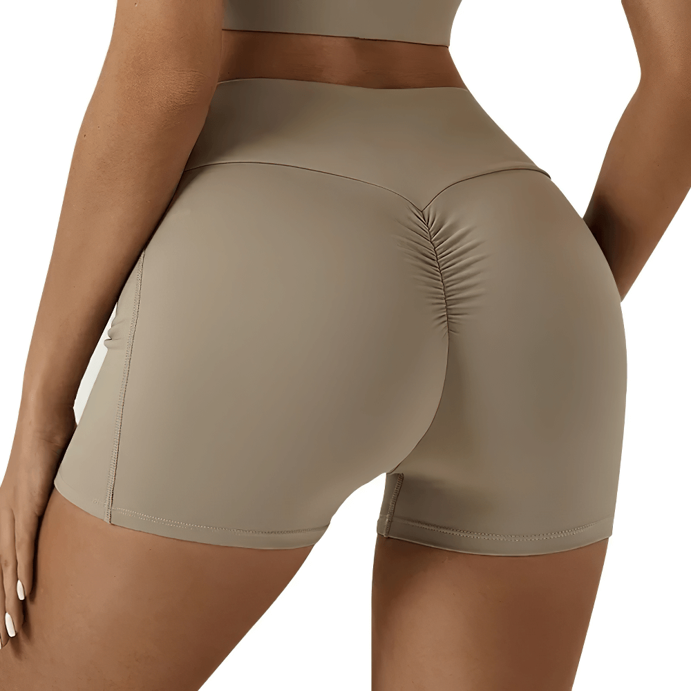 Back view of Tight Fitting High Waisted Scrunch Yoga Shorts - SF4119 showcasing scrunch detail and pocket design for active women.
