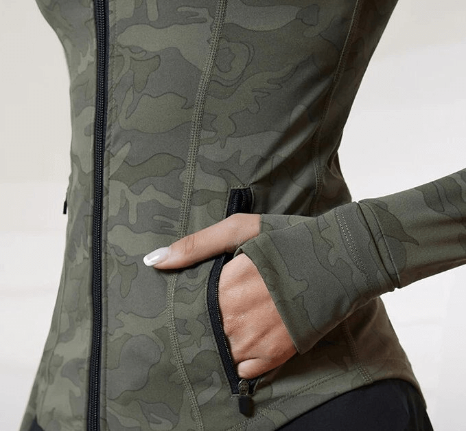 Close-up of a camo Tight Sports Women's Jacket with full zipper and pockets, showcasing breathable, quick-dry fabric ideal for workouts.