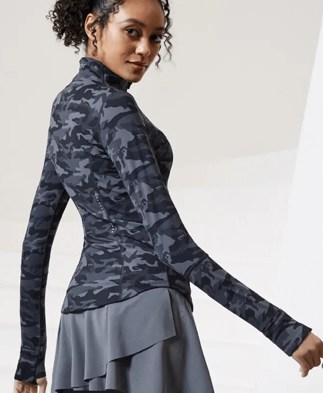 Sporty woman wearing tight camo jacket, showcasing breathable quick-dry fabric with zipper and pockets, ideal for female athletes.