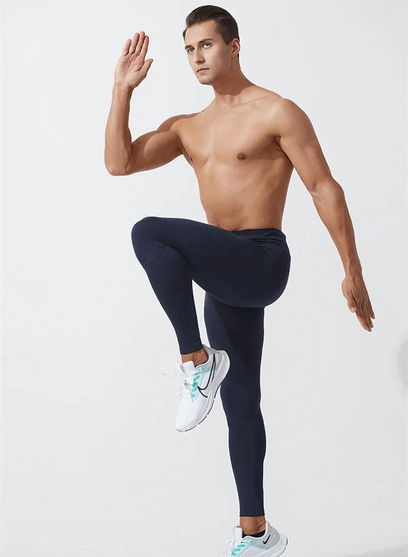 Model wearing Tight Sporty Men's Leggings with Back Pocket, perfect for athletic activities, showcasing slim fit and mobility.