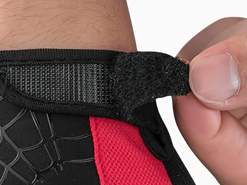 Close-up of adjustable wrist strap on breathable cycling gloves for a secure fit.