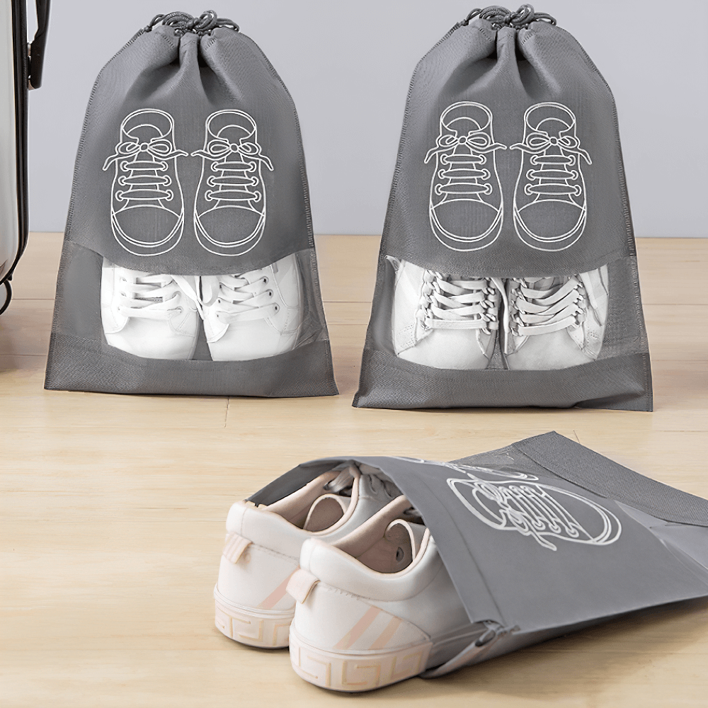 Transparent drawstring shoe bags with clear panel, perfect for organizing and protecting sneakers during travel.