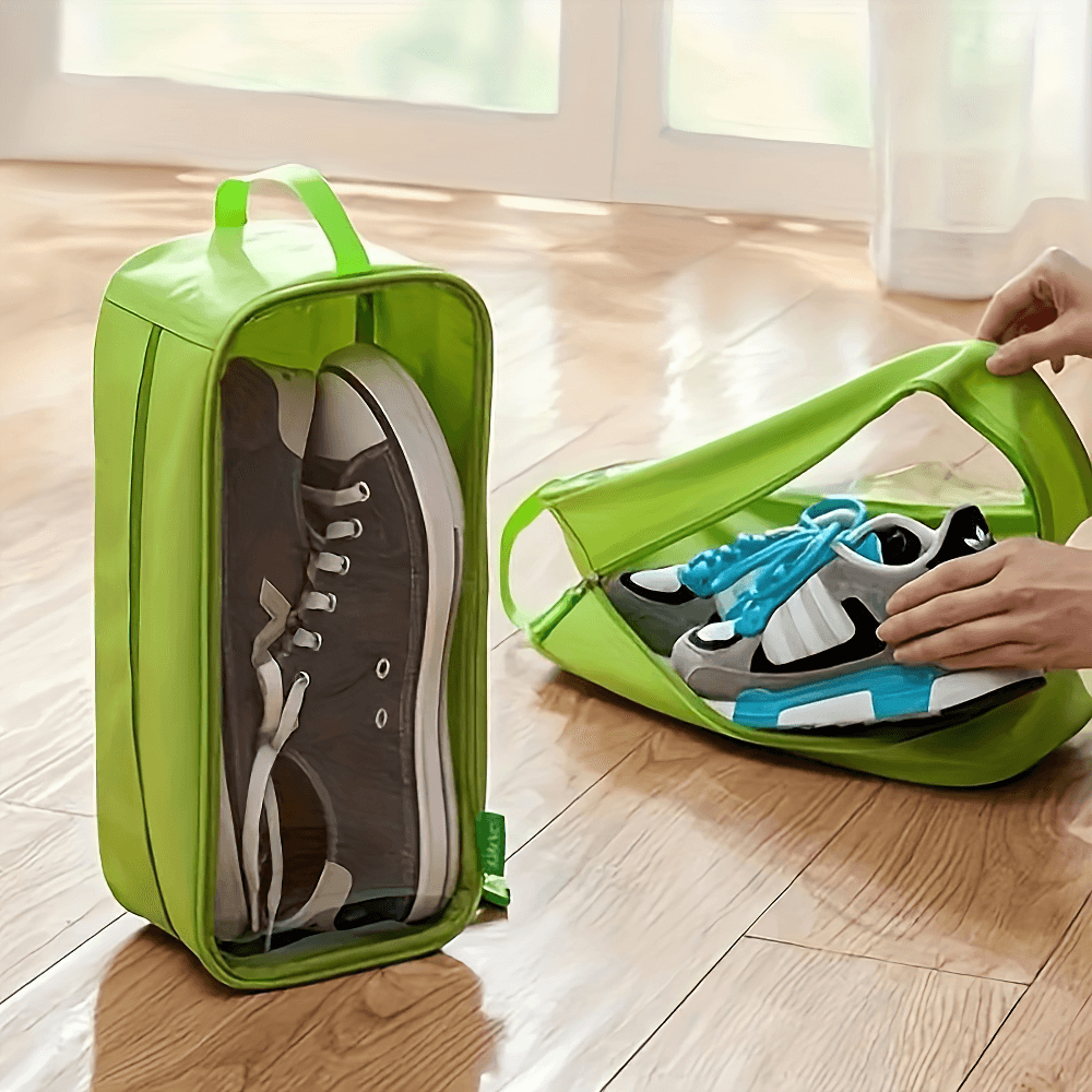 Transparent shoe storage bag with handle showcasing shoes, perfect for travel and gym. Waterproof design with easy access zipper.