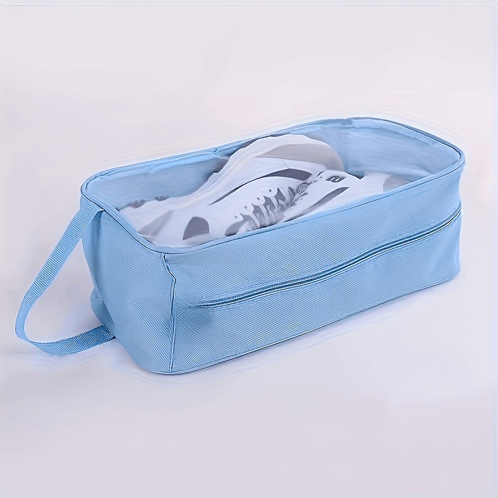 Transparent travel shoe storage bag SF2669 with shoes inside, waterproof and portable with handle, perfect for travel and gym use.