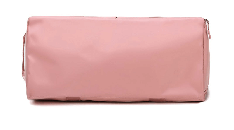 Pink travel shoulder bag with waterproof compartments, made of durable nylon. Ideal for workouts and trips, 35L capacity.