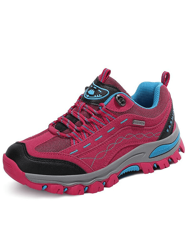 Vibrant pink women's trekking sneaker with lace-up design, ideal for hiking. Featuring durable rubber outsole and comfortable cushioning.