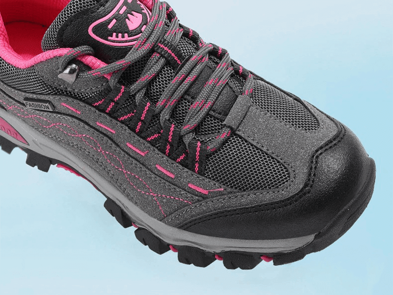 Trekking women's sneakers with lace-up design, black and pink, offering comfort and grip for hiking, SF0232 model.