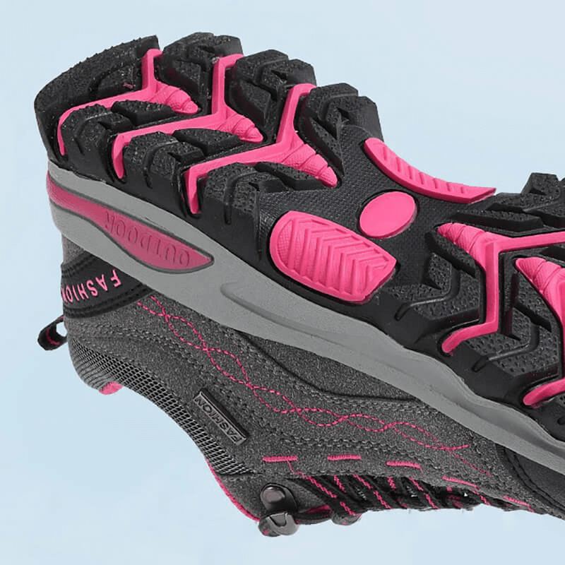 Close-up of pink and black Trekking Women's Sneakers, SF0232, showing durable rubber outsole and synthetic lining for hiking.