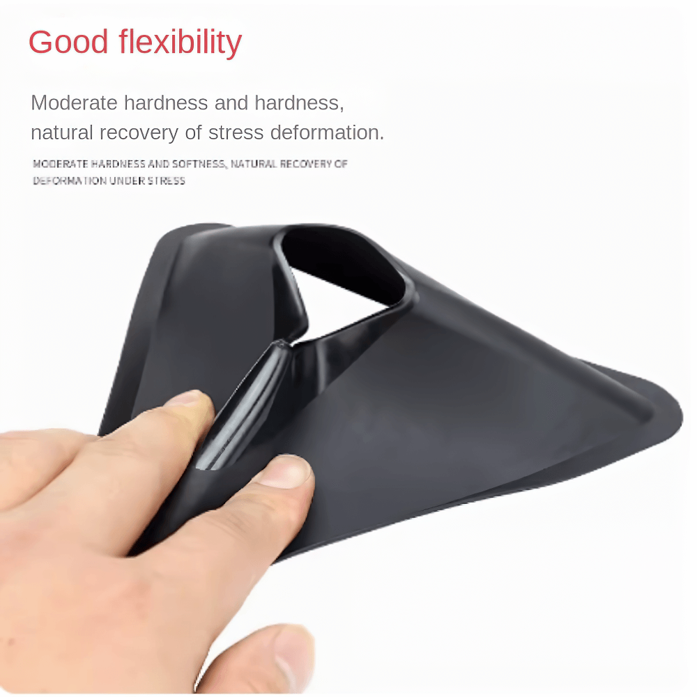 Flexible black triangle field marker cone being bent by hand, showcasing material durability for soccer and sports training.