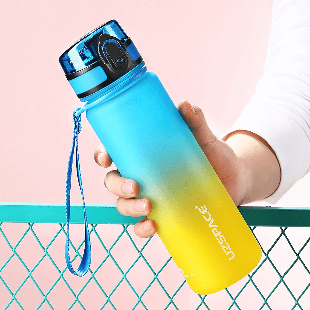 Vibrant Tritan Sports Water Bottle with bounce lid, timeline reminder, and secure grip for outdoor fitness, BPA-free and leakproof.