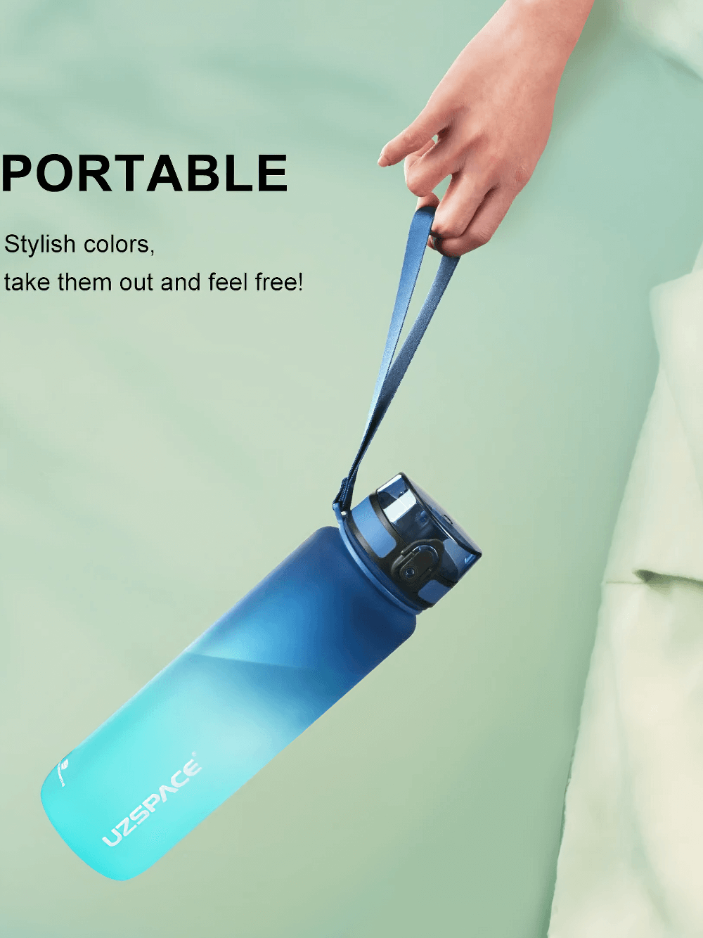 Hand holding a blue Tritan sports water bottle with strap, highlighting its portable design for active lifestyles.