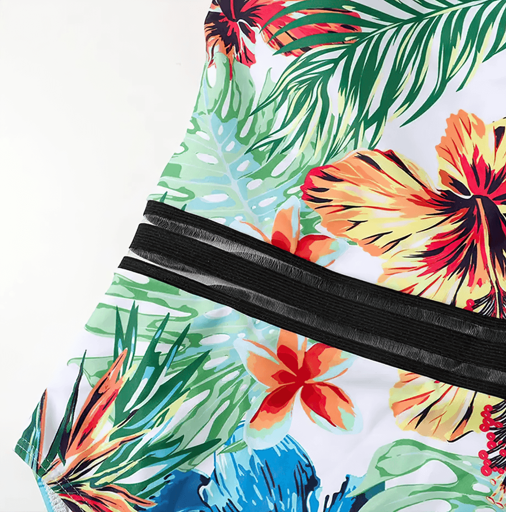 Tropical Print Cross Tape One Piece Swimsuit - SF4649 featuring tropical floral patterns and cross-front mesh tape straps.