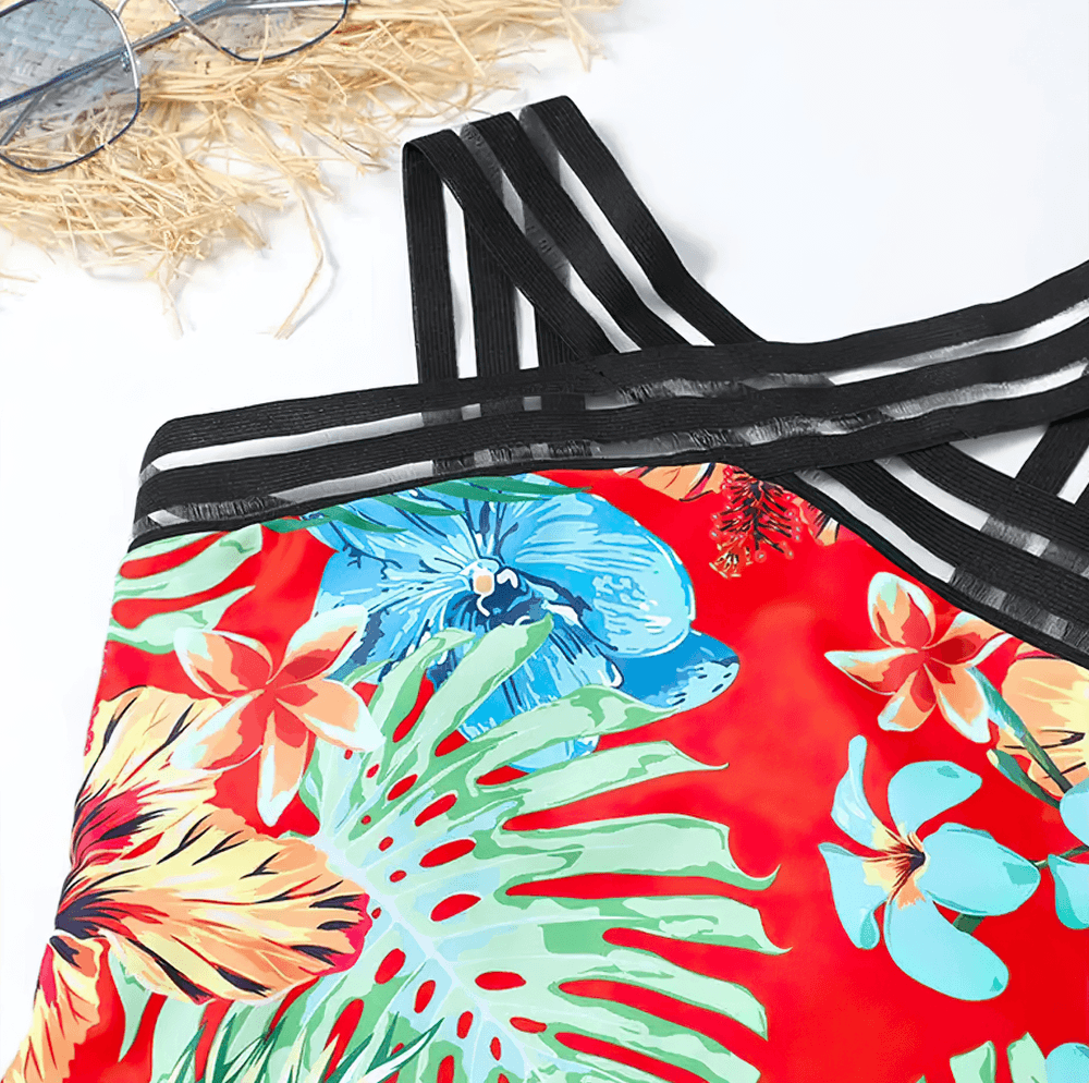 Tropical Print Cross Tape One Piece Swimsuit - SF4649 featuring vibrant floral design and black mesh tape straps.