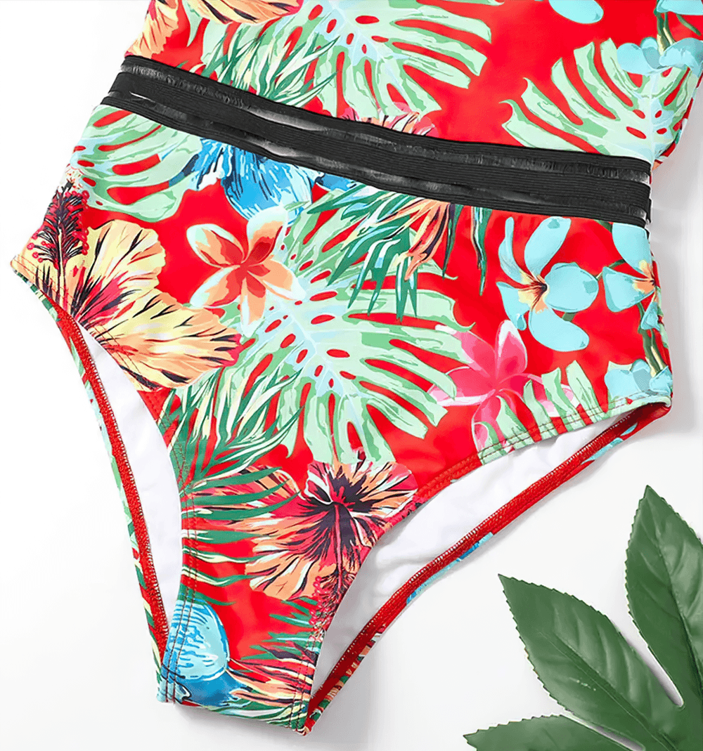 Tropical Print Cross Tape One Piece Swimsuit - SF4649 featuring vibrant floral design and mesh tape detail.