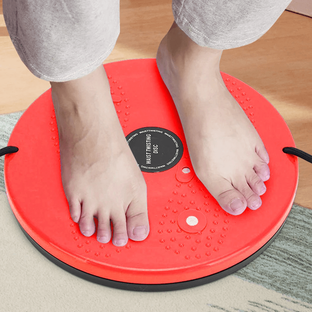 Feet on a red twist waist disc with resistance bands for core training and balance improvement, model SF3224.