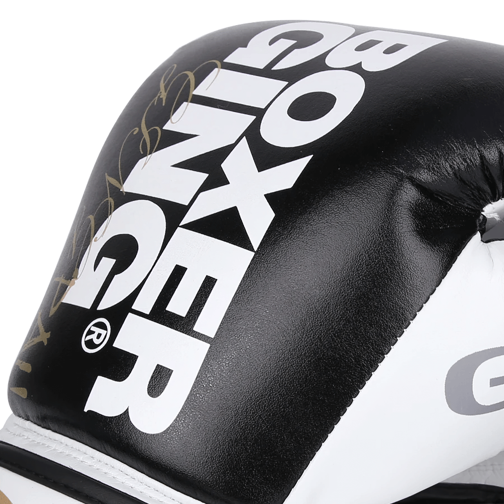 Close-up of stylish two-tone leather boxing glove with bold text design, ideal for training and sparring.