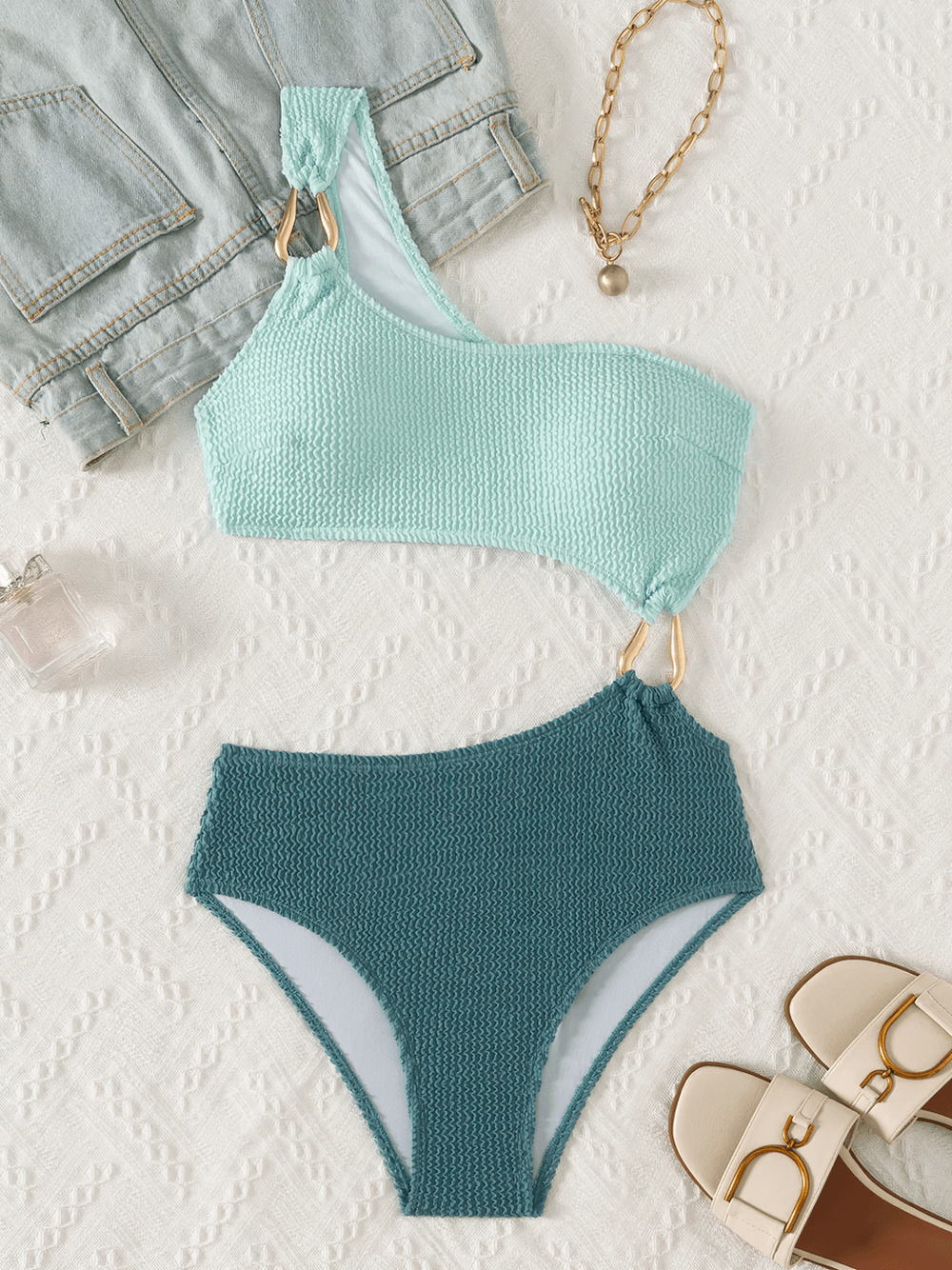 Two-Tone Textured One Shoulder Monokini Swimsuit - SF4763 displayed with stylish accessories.