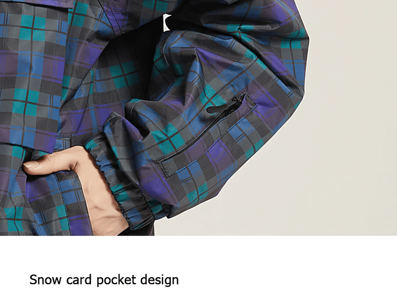 Close-up of plaid skiing jacket with large pocket and arm detail, showcasing snow card pocket design.
