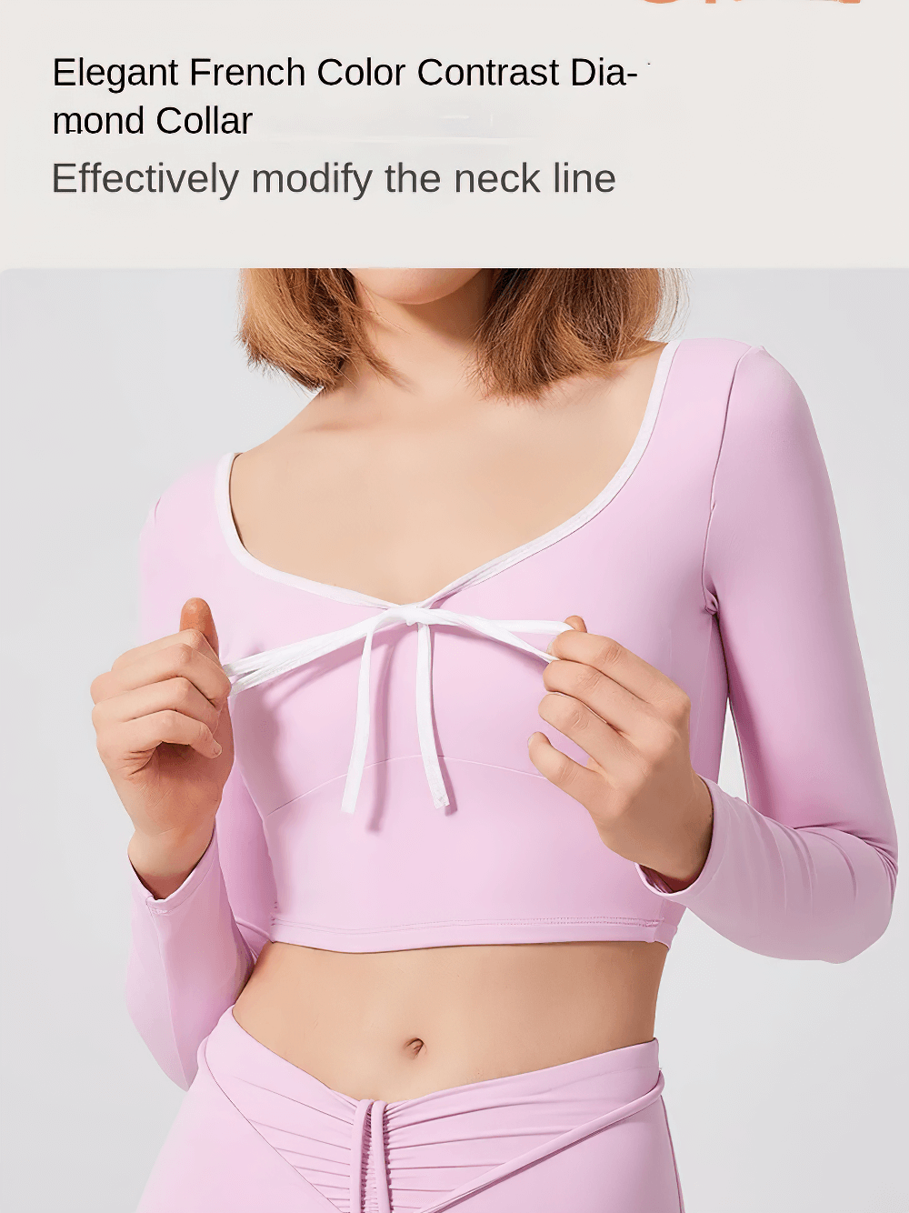 Pink U-neck long-sleeve yoga top with contrast trim, chic bow detail, enhancing neckline for stylish fitness or outdoor activity.