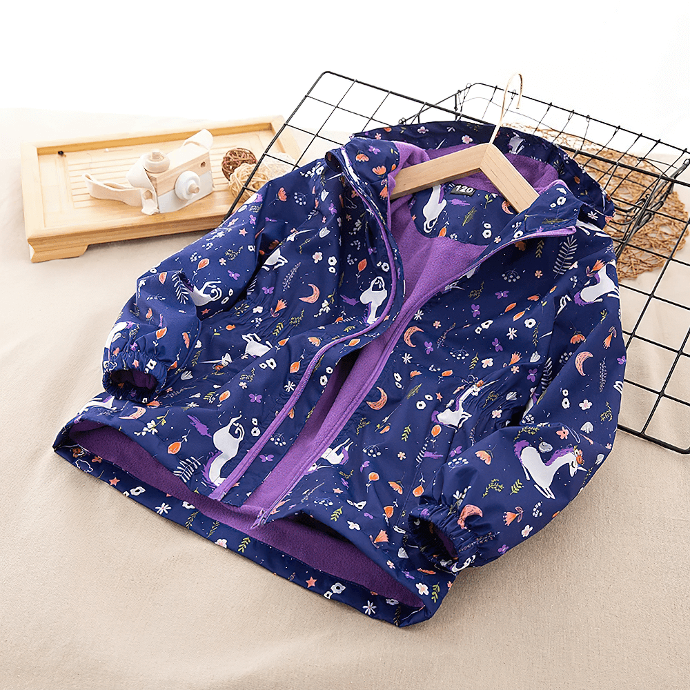 Adorable Unicorn Hooded Rain Jacket With Pockets For Girls - SF3609, featuring a playful unicorn pattern and cozy purple lining.
