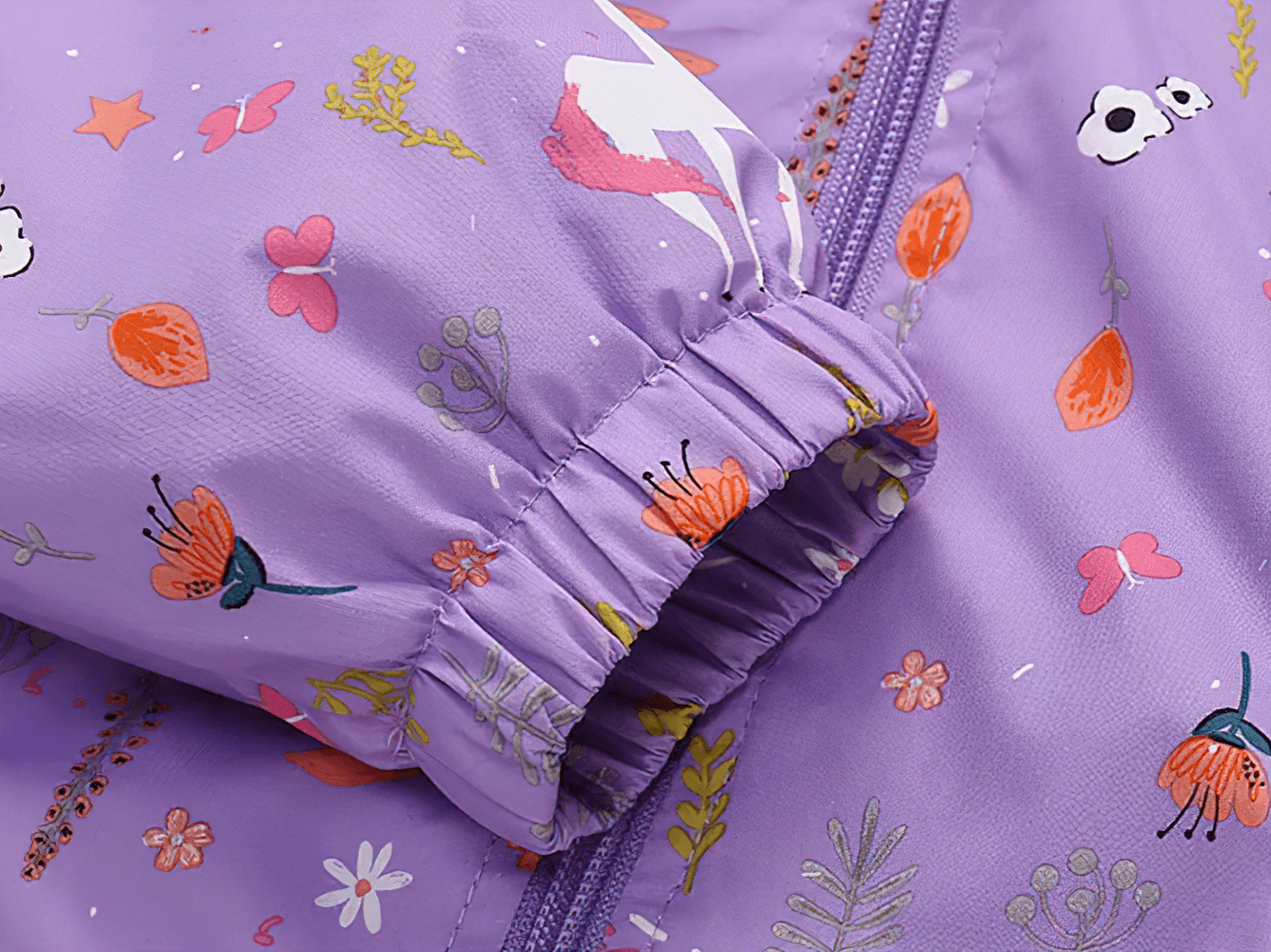 Close-up of Unicorn Hooded Rain Jacket With Pockets For Girls - SF3609, showing vibrant unicorn pattern and elastic sleeve detail.