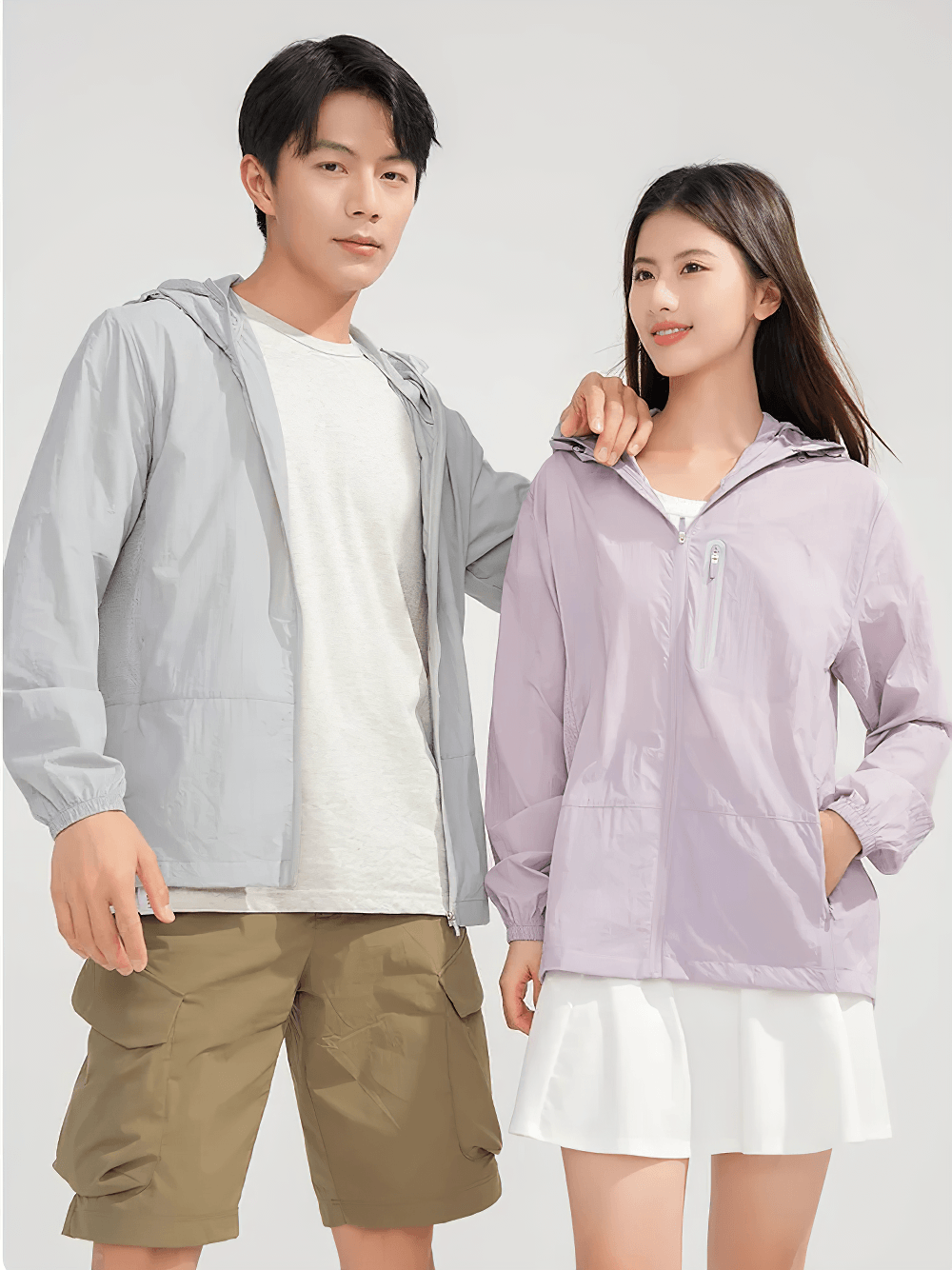 Unisex Anti-UV Hooded Outdoor Windbreaker Jacket - SF4760 worn by a man and a woman in light colors.