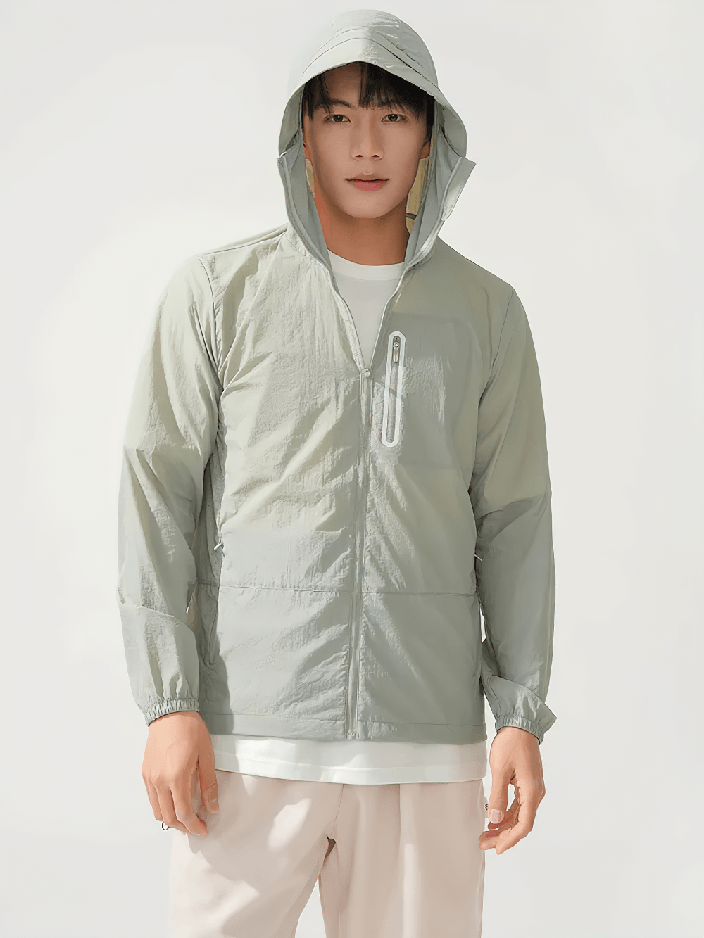 Unisex Anti-UV Hooded Outdoor Windbreaker Jacket - SF4760 model wearing a light green windbreaker in outdoor setting.