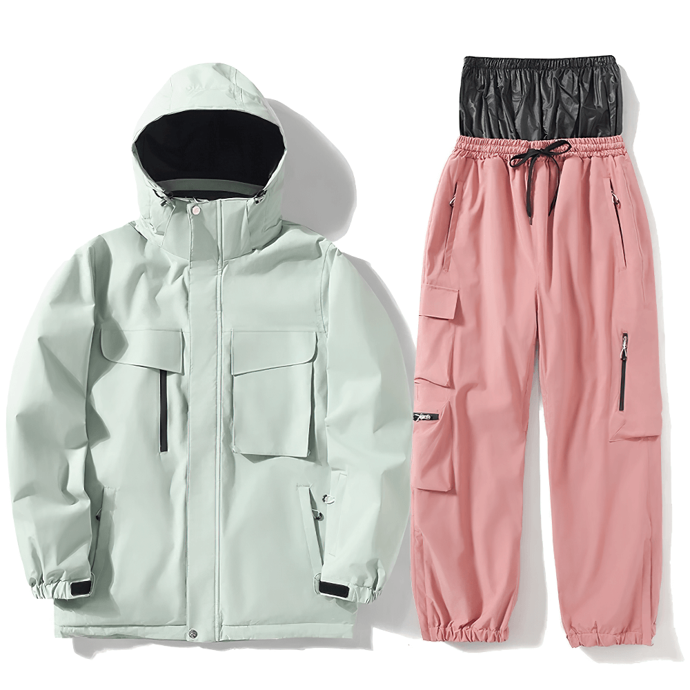 Pastel green hooded ski jacket and pink pants set for unisex snowboarding. Durable, waterproof, and breathable gear for skiing.