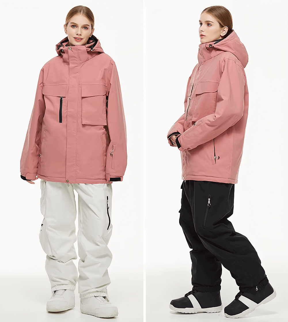 Unisex breathable ski jacket and pants set in pink and white with ergonomic fit, ideal for skiing or snowboarding.